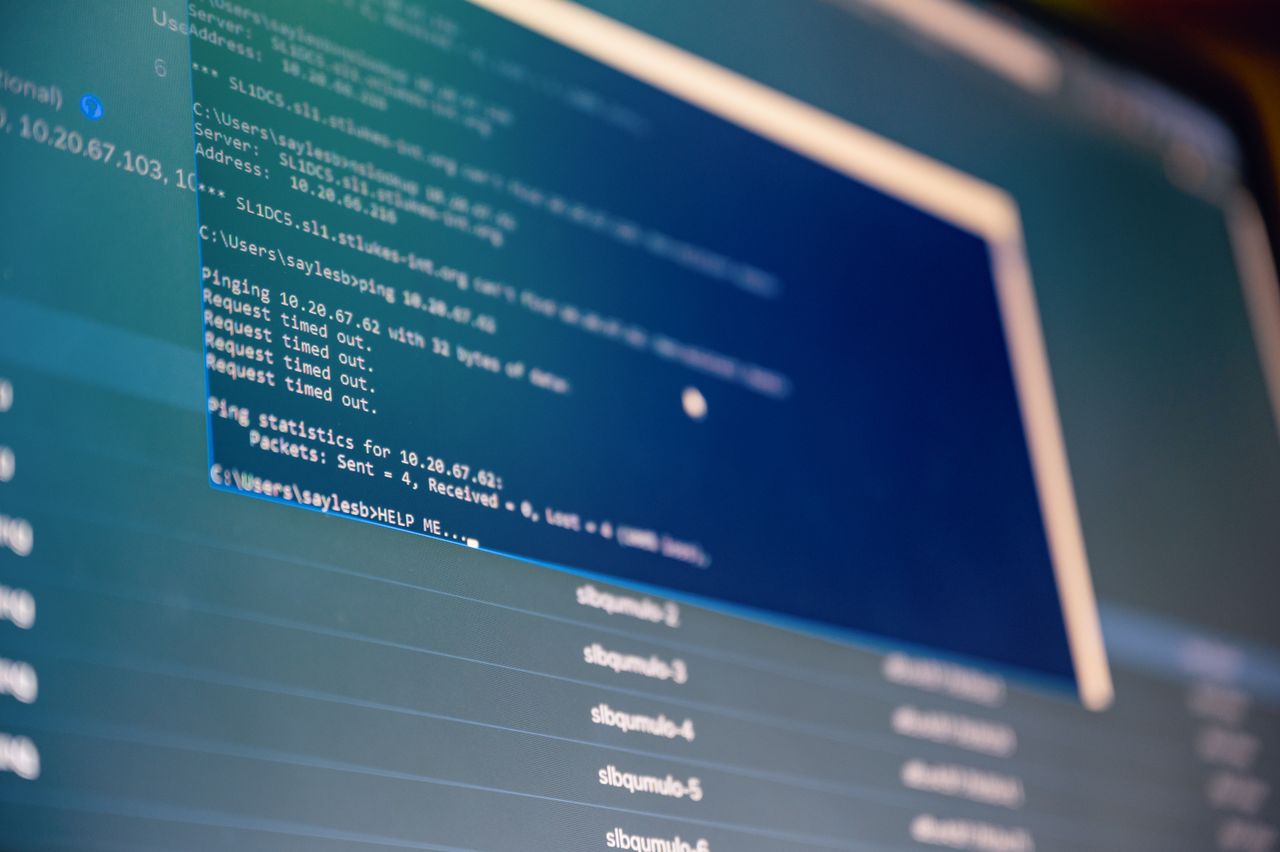 Services From below of monitor of modern computer with opened files on blue screen